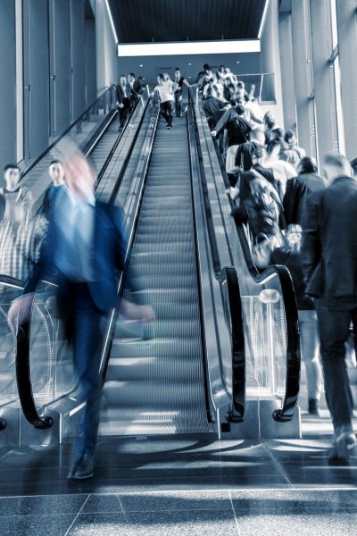Motion Blurred business on a escalator